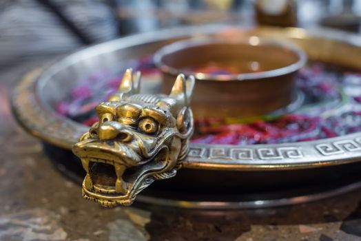 Chengdu Sichuan Hot Pot close up with dragon head sculpted handles, Chenggdu, Sichuan Province, China