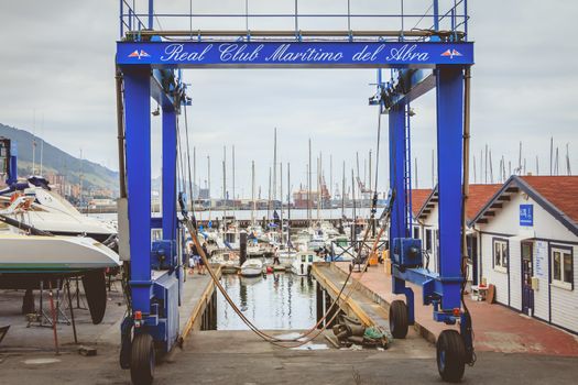 Getxo, Spain - July 20, 2017 : example of a travel lift on the harbor of a sailor club on a summer day