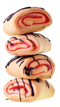 Cookies rolls with strawberry jam and chocolate icing isolated on a white background.