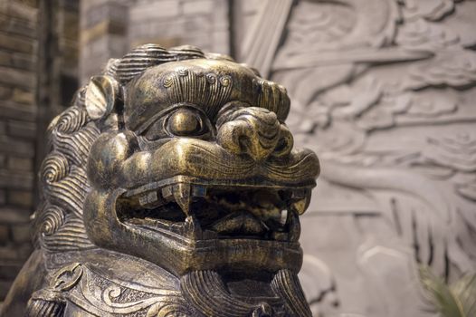 Lion bronze statue at night in a chinese street in Chengdu, China