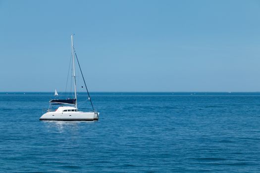 luxury boat anchored in the middle of a turquoise sea paradise