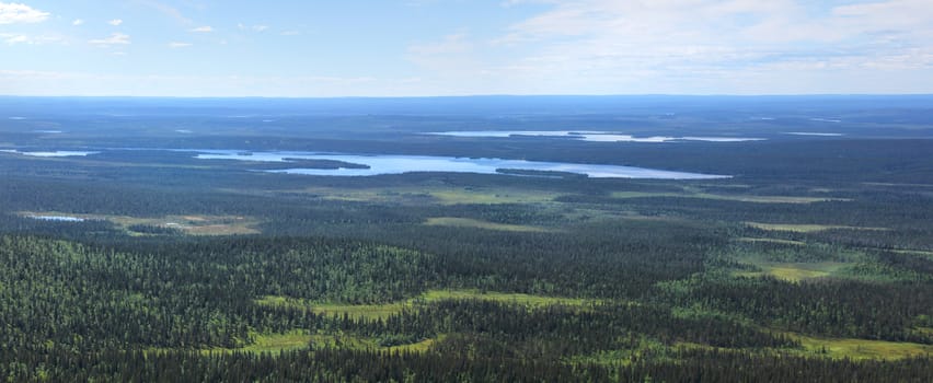 Beautiful panoramic view from fell Pallastunturi over forests, lakes and marshes of Lapland