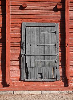 Old weathered wooden magazine warehouse door