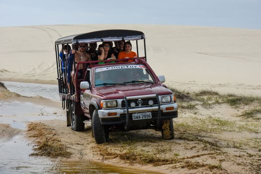 Atins, Brazil - 12 January 2019: tourist truck on the dunes at Lencois Maranhenese National Park in Brazil