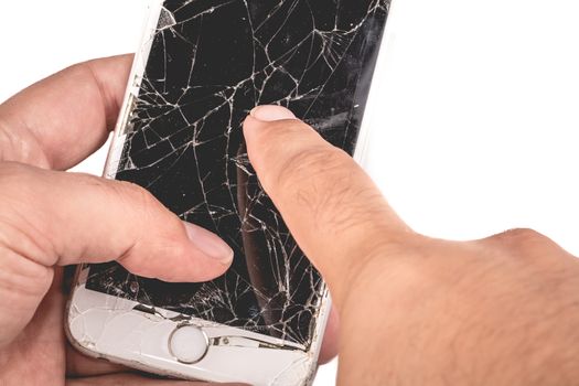 Paris, FRANCE - August 26, 2017: A man holds in his hand an iphone 6S of Apple Inc. whose screen is broken as a result of a violent fall