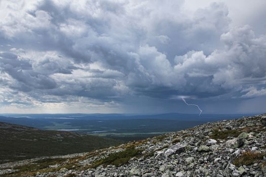 Thunderstorm with lightning and heavy rain approaching Fell Pallastunturi in Finnish Lapland