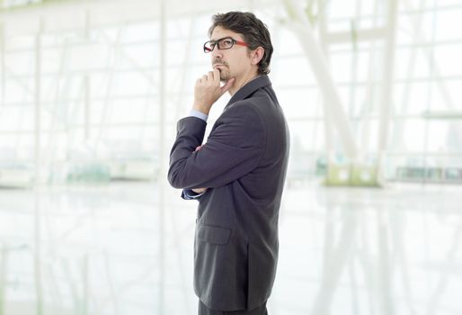 young business man thinking, at the office