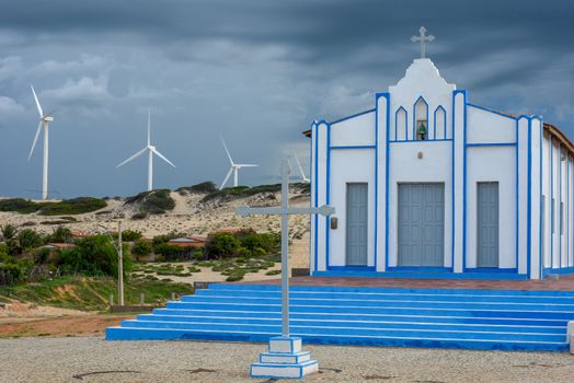Church in front of Wind farm at Canoa Quebrada on Brazil