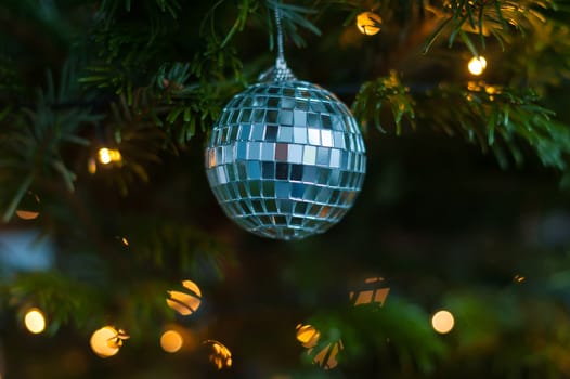 Christmas illuminations and ball decorations on a pine tree