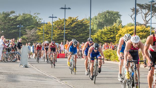 Saint Gilles Croix de Vie, France - September 10, 2016 : Final triathlon championship of France in the category D3 - cyclists straight for a road bike race