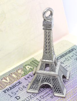 Close up of the Eiffel tower keychain on the Schengen visa allowing the passport holder to travel inside the Schengen treaty territory