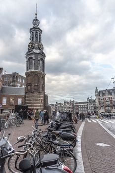 AMSTERDAM, 31 March 2018 - View of the originally part of the Amsterdam wall. This  tower (Munttoren in Dutch) was rebuilt in 1620 & features a carillon with bells.