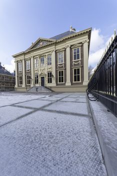 The Hague, 28 February 2018 - The main building of the Mauritshuis museum covered by a thin layer of snow with a frizzy weather temperature outside. 
