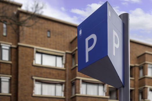 Parking panel and sign in a resident area under a bleu ski