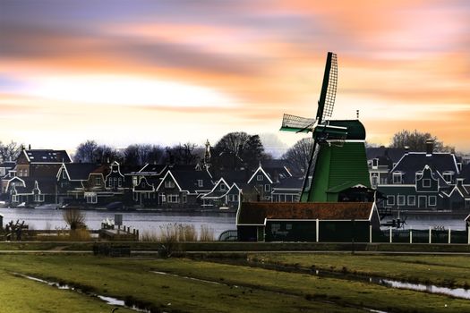 Sunrise on the sawmill at the river side in Zaanse Schans, Netherlands