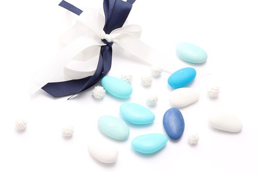 Blue and white sugared almonds isolated on white