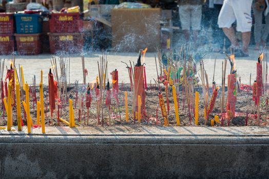 Prachinburi, Thailand - April 7, 2019 : Thai Chinese respect ancestors parents those died by food and burn fake money to sacrifice them at cemetery in Qingming Festival (Qing Ming), Tomb-Sweeping Day