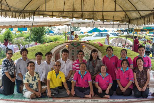 Prachinburi, Thailand - April 7, 2019 : Thai Chinese respect ancestors parents those died by food and burn fake money to sacrifice them at cemetery in Qingming Festival (Qing Ming), Tomb-Sweeping Day