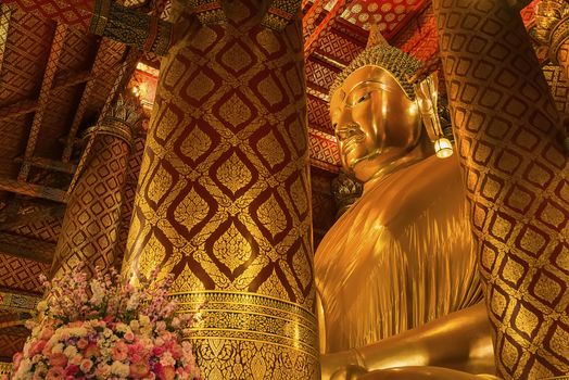 Ayutthaya, Thailand -July, 31, 2018 : Giant golden Buddha in Wat Phanan Choeng, Buddha statue is called Luang Pho Tho of Ayutthaya, Thailand
