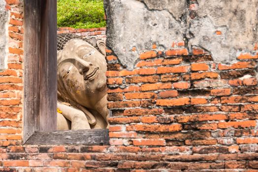 Ayutthaya Thailand June 13, 2020 : Reclining Buddha in the temple,Archaeological site,Pagoda Putthaisawan Temple Ayutthaya , Thailand