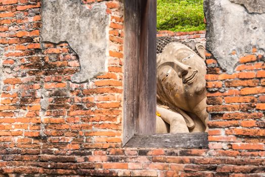 Ayutthaya Thailand June 13, 2020 : Reclining Buddha in the temple,Archaeological site,Pagoda Putthaisawan Temple Ayutthaya , Thailand