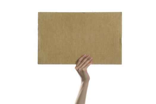 Woman hand holding a blank placard to put the text.