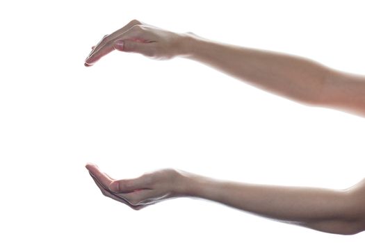 Female open cupped hands with empty between on white isolated background.