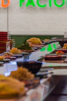 Bangkok, Thailand - May 8, 2016 : Unidentified chef cooking a food in the Japan food restaurant sushi conveyor or belt buffet for customer service in Thailand