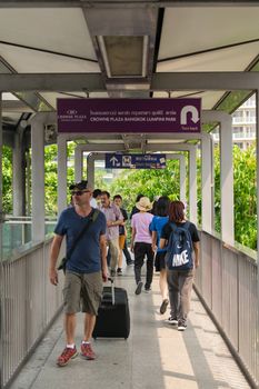 Bangkok, Thailand - March 31, 2016 : Skywalk at BTS skytrain train in Bangkok. Many people in Bangkok used skytrain to save time.