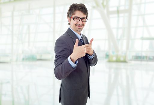 young business man going thumb up, at the office