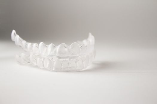 Postural plastic denture teeth correction.