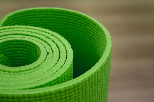 Green Shallow focus image of colorful, rolled up yoga mat. Fotografía de Gema Ibarra. Prohibida su utilización para cualquier uso sin autorización.Todos los derechos reservados.