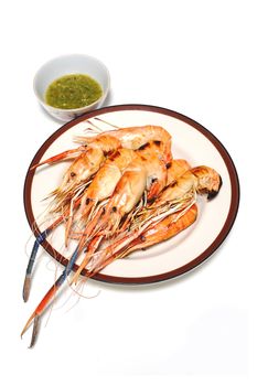 Grilled Shrimps on plate with Thai Seafoods Dipping Sauce. on white background.