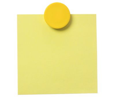 Yellow adhesive note and magnet button on whiteboard.