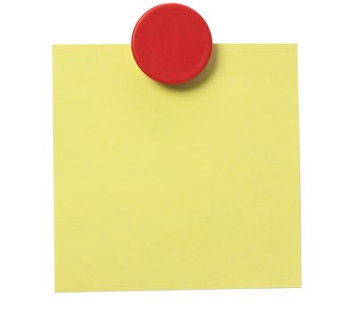 Yellow adhesive note and red magnet button on whiteboard.