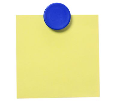 Yellow adhesive note and blue magnet button on whiteboard.