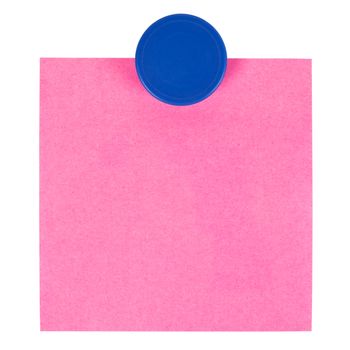 Adhesive note and magnet button on whiteboard.