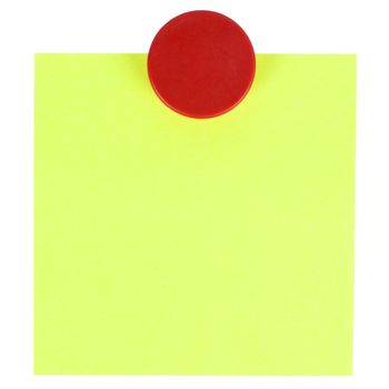 Adhesive note and magnet button on whiteboard.