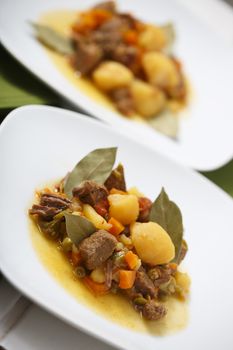 Beef stew with potatos and carrots.