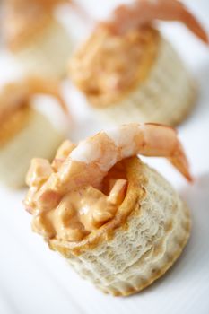 Delicious tarts with prawn, crab and thousand island dressing. Selective focus.