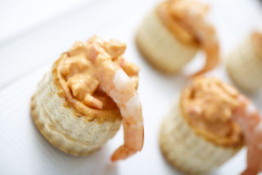 Delicious tarts with prawn, crab and thousand island dressing. Selective focus.