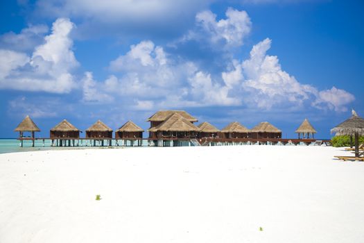 View of Bungalows on the horizon over the water.