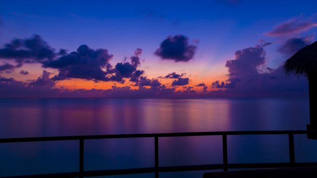 Gorgeous dusk in Maldives. Shot is from the deck of an over water bungalow.