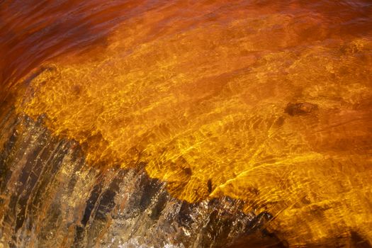 Beautiful landscape in Huelva, Rio Tinto, small cascade with water flowing