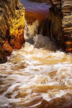 Beautiful landscape in Huelva, Rio Tinto, small cascade with water flowing