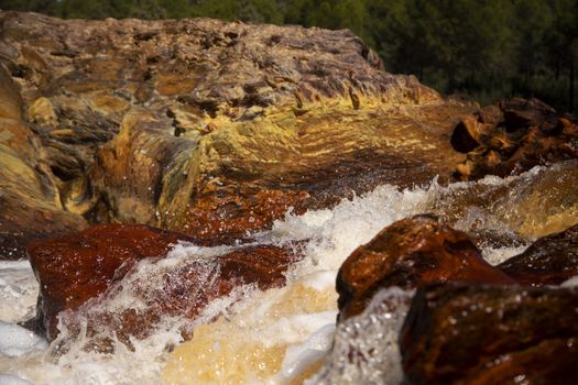 Beautiful landscape in Huelva, Rio Tinto, small cascade with water flowing