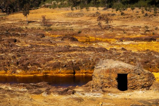 Beautiful house made out of stones in the middle of rio Tinto, Huelva.