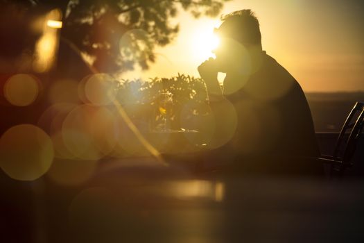 Sunset with the sun against leaving a beautiful silhouette of a man.