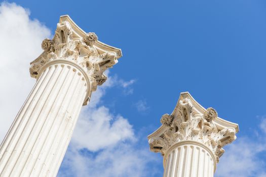 corinthian columns style reaching out for the sky in outdoors.