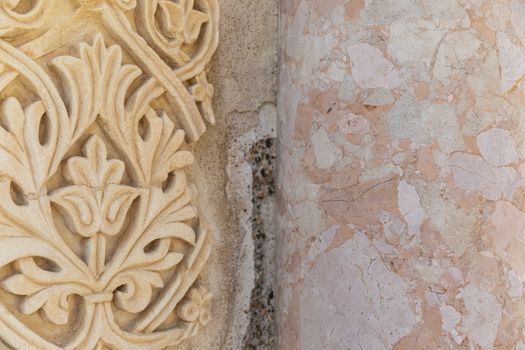 Cordoba, Spain -  November 1 2019: Fragment of wall with floral paterns in 10th century ruined Moorish medieval city Medina Azahara in Andalucia on November 1, 201. UNESCO world heritage site.